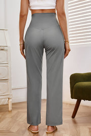 Gray high-waisted flare leg trousers with a V-shaped seam detail.