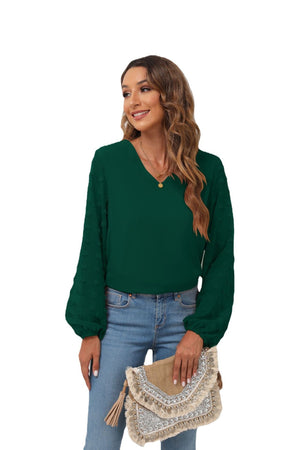 Forest green V-neck blouse with pom-pom textured balloon sleeves.