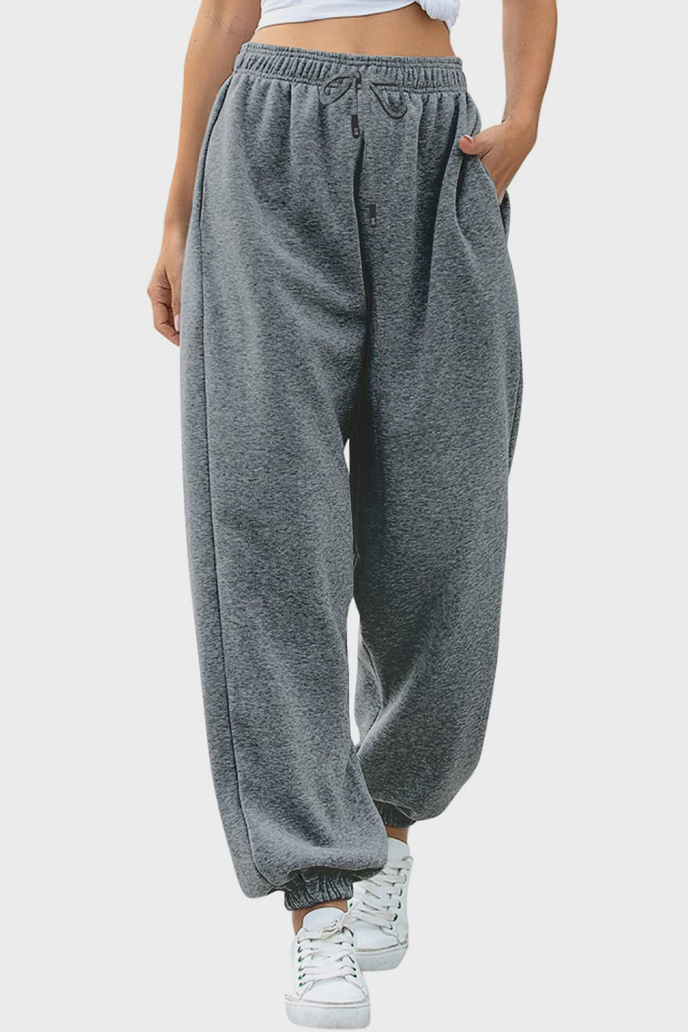 Relaxed-fit gray cuffed sweatpants with drawstring and pockets.