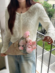 White lace button-up cardigan with floral pattern and crew neck.
