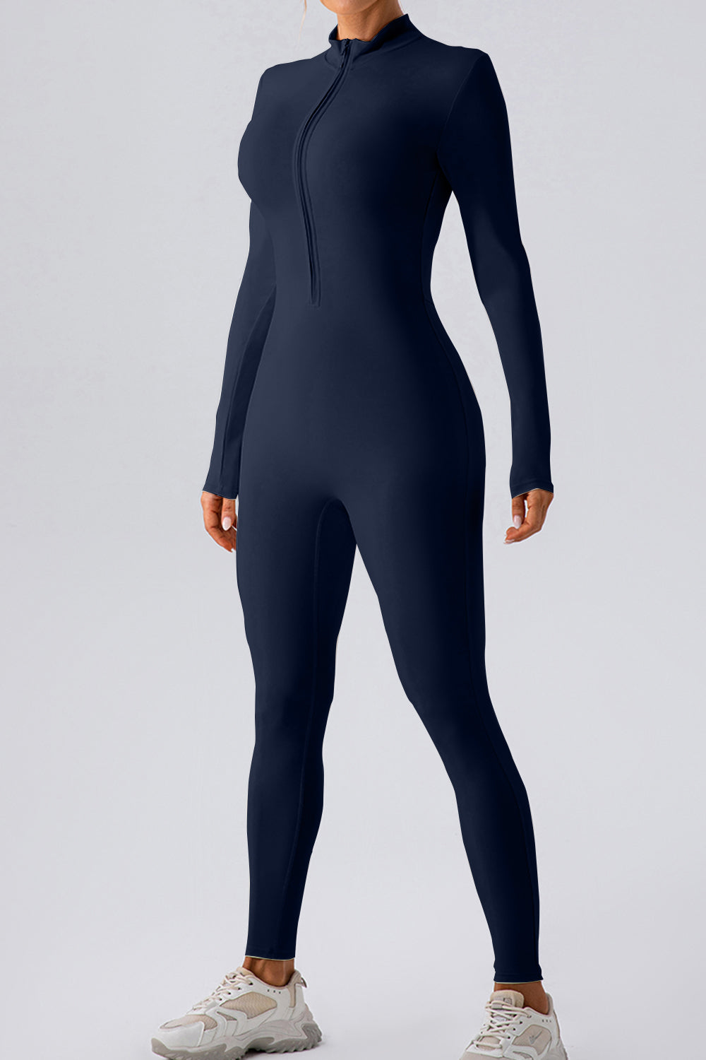 Dark blue zip-front bodycon jumpsuit with long sleeves and mock neck.