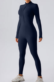 Dark blue zip-front bodycon jumpsuit with long sleeves and mock neck.