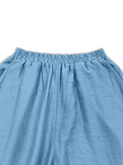 Sky blue wide-leg trousers with elastic waistband and textured fabric detail.