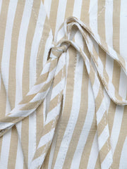 Chic striped two-piece set with tie-front vest detail in cotton fabric.