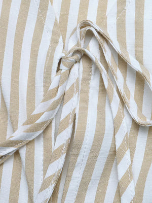 Chic striped two-piece set with tie-front vest detail in cotton fabric.