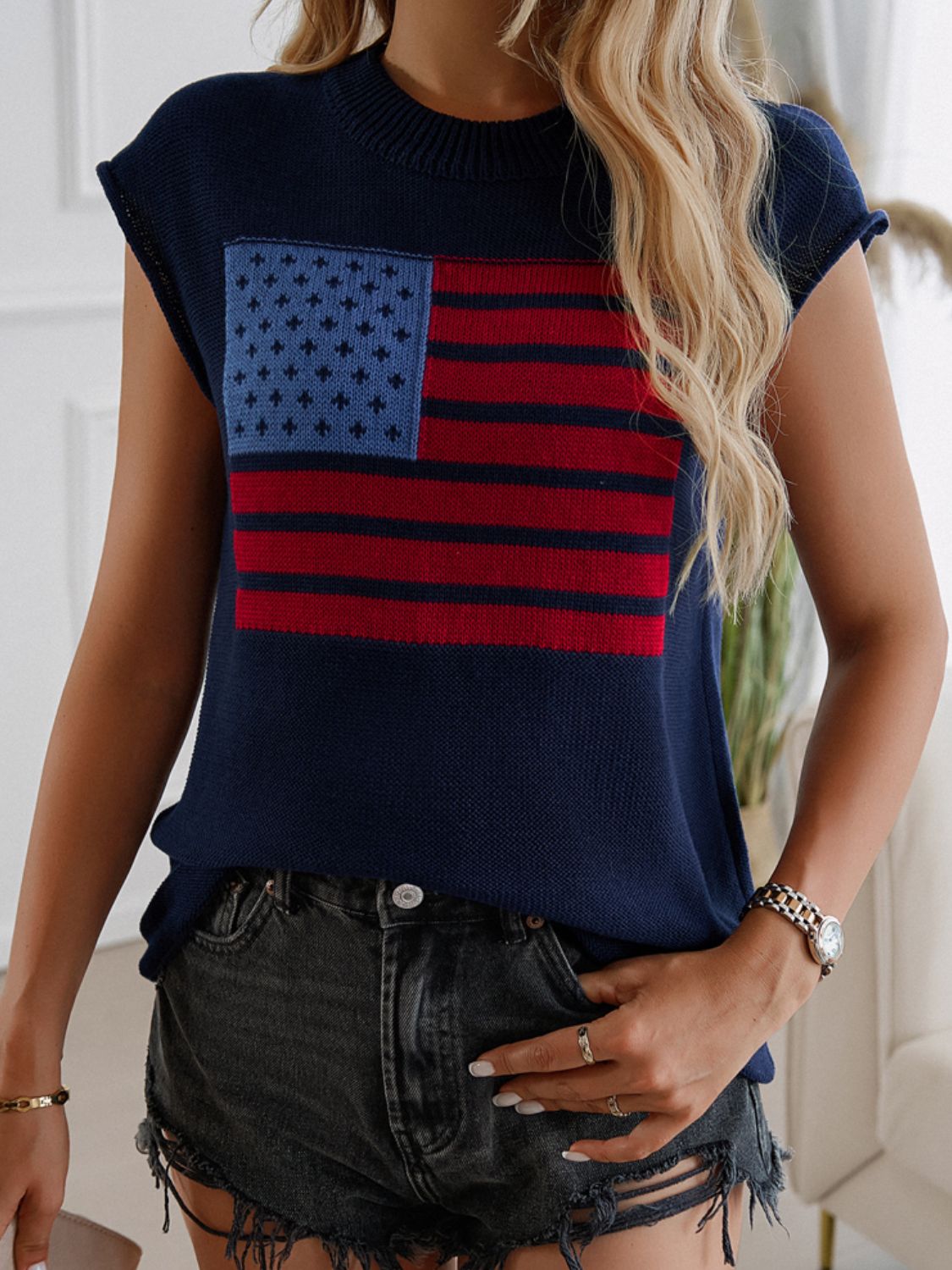 Navy knit vest with American flag pattern, crew neck, sleeveless.