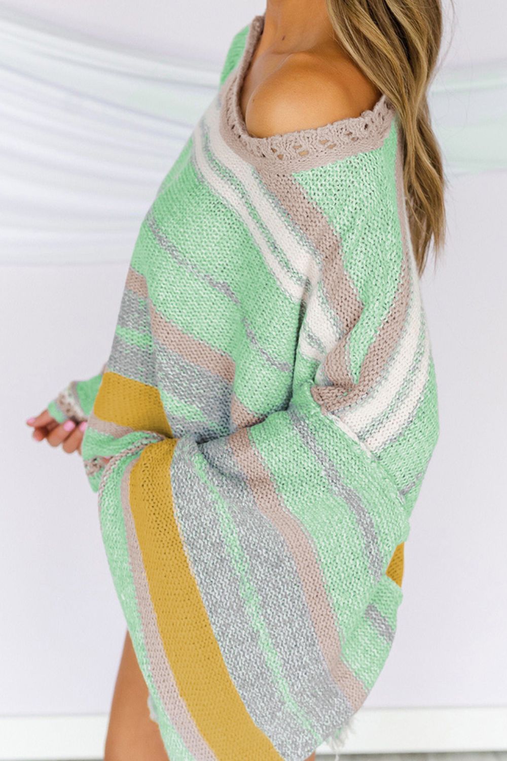 Open-shoulder striped knit pullover in Gum Leaf with a boatneck and crochet trim detail.