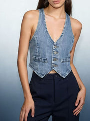 Light blue denim cropped vest with button-down front and two chest pockets.