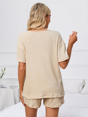 Textured ribbed knit lounge set in light yellow, featuring a short sleeve top and matching shorts.
