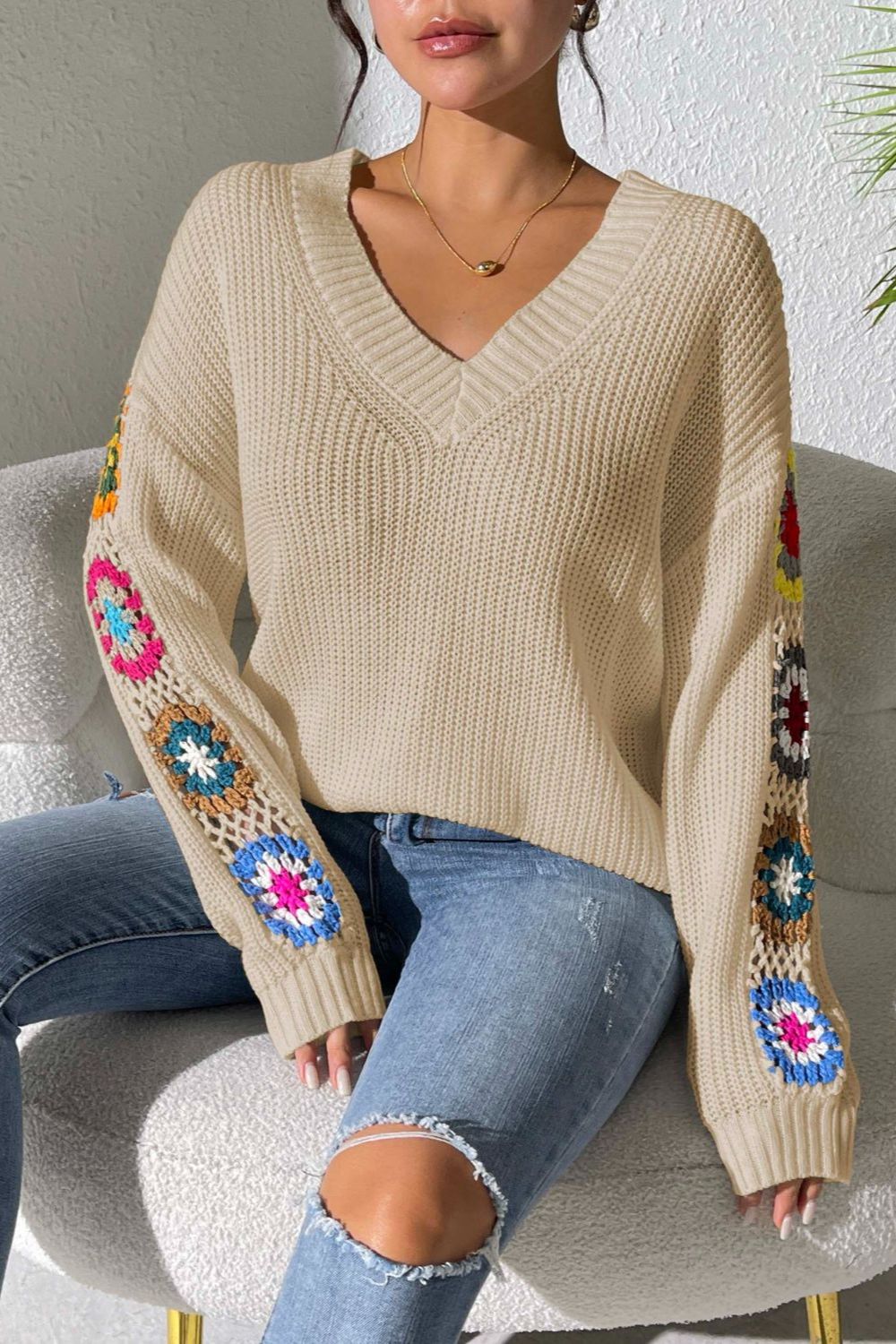 Tan v-neck sweater with colorful crochet granny square sleeves