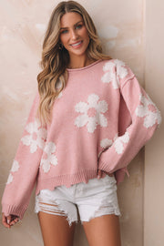 Blush pink knit sweater with white floral appliques and pearl embellishments.