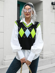 Argyle knit sweater vest with neon green trim and diamond pattern.