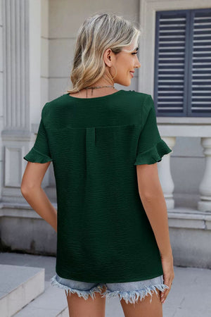 Dark green textured blouse with flutter sleeves and pleat front detail.