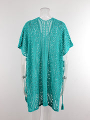 Teal open-knit V-neck beach cover-up with short sleeves and tassels.