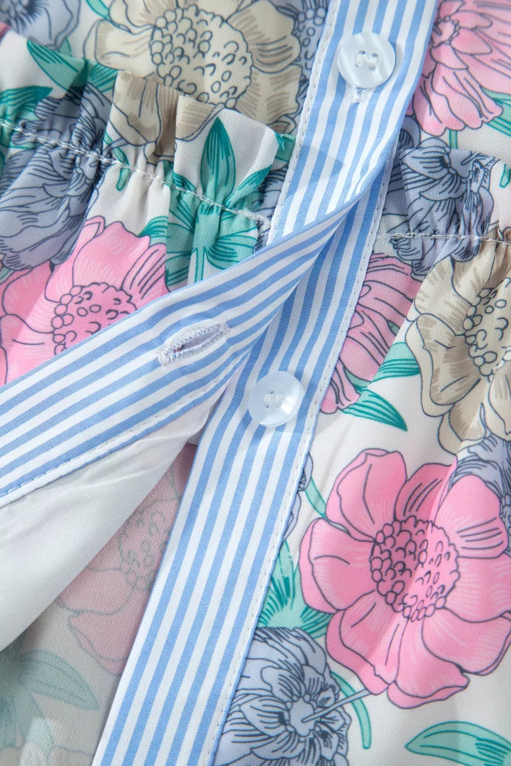 Floral print mini dress with contrast stripe button front and ruffle detail.