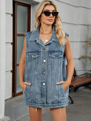 Denim vest with American flag detail, button front, collar, and frayed hem.