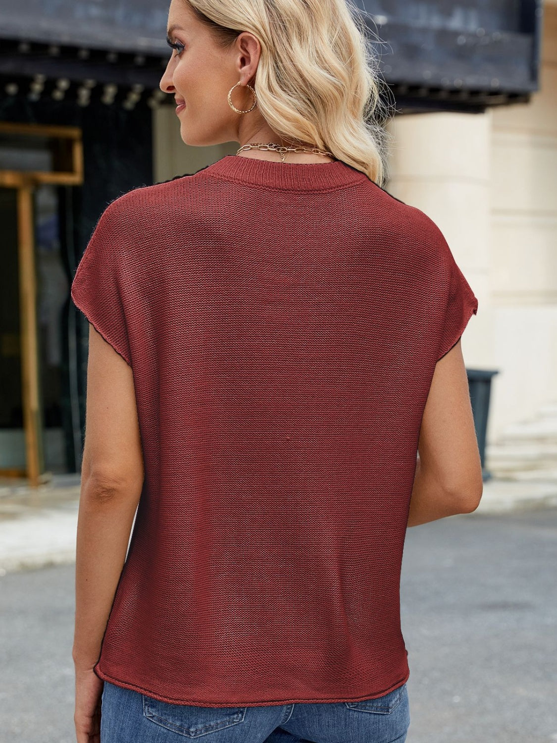 Burgundy knit cap sleeve top with vertical seam detail.