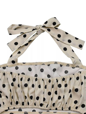 Cream polka dot cami with tie straps and ruffled hem detail