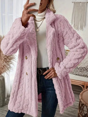 Pink faux shearling double-breasted overcoat with cable knit texture and button closure.