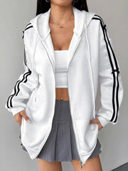 White zip-up hoodie with black stripes and bow details on sleeves.
