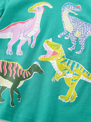 Teal cotton crew neck t-shirt with a colorful dinosaur print featuring Parasaurolophus, Tyrannosaurus Rex, and other