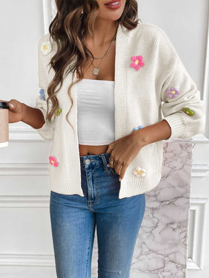 White knit open-front cardigan with embroidered multicolor flowers.