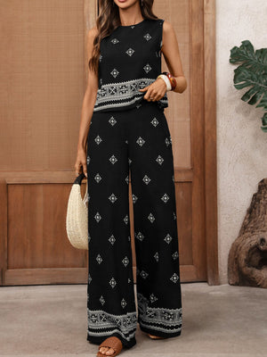 Black sleeveless top and wide-leg pants set with geometric print and ornate border detail.