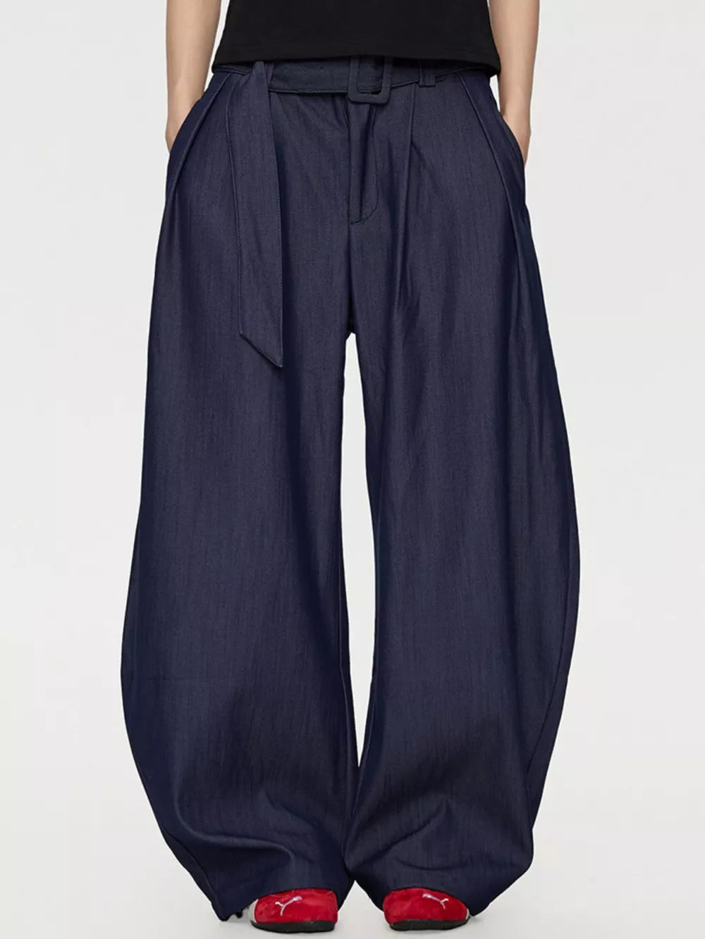 Men's blue wide-leg dress pants with a belted waist and pleats.