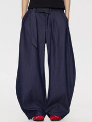 Men's blue wide-leg dress pants with a belted waist and pleats.