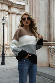 Crewneck knit sweater with horizontal color blocks in brown, white, gray, and black acrylic.