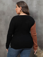 Colorblock crossover knit sweater in black and caramel acrylic with long sleeves.