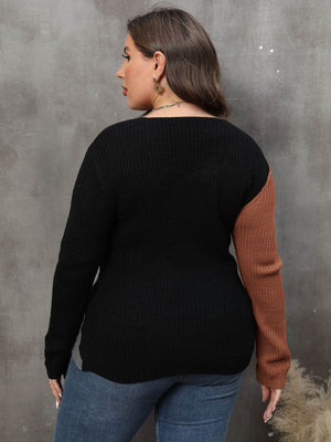 Colorblock crossover knit sweater in black and caramel acrylic with long sleeves.