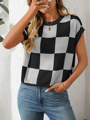 Checkerboard knit cap sleeve top in black and white, casual crewneck sweater.