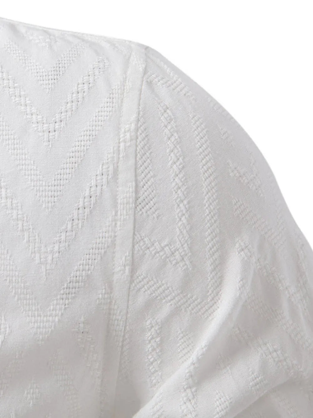 White geo-embossed henley shirt with mandarin collar and textured fabric detail.