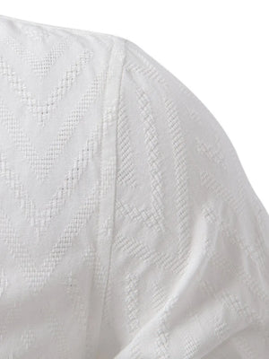 White geo-embossed henley shirt with mandarin collar and textured fabric detail.