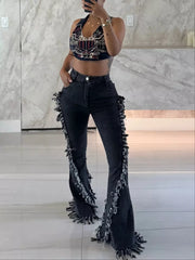 Black gray high-waist flare jeans with deconstructed frayed hem detail.