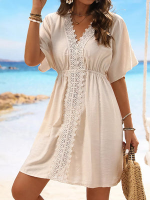 Tan V-neck cover-up dress with lace trim and elastic waist.