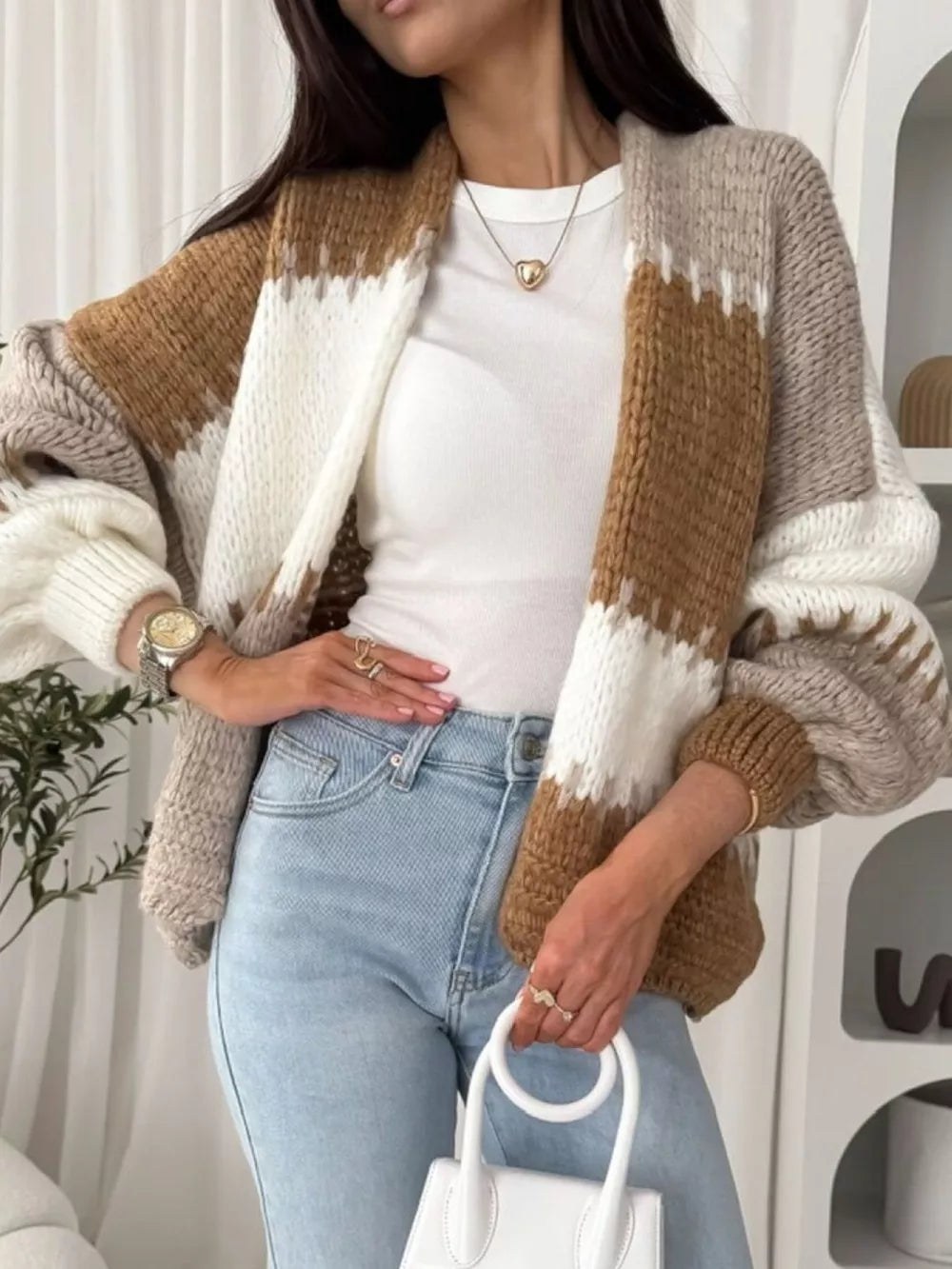 Open front cardigan with balloon sleeves in brown, white, and beige stripes.