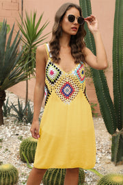 Yellow crochet yoke cover-up dress with colorful granny squares and V-neck.