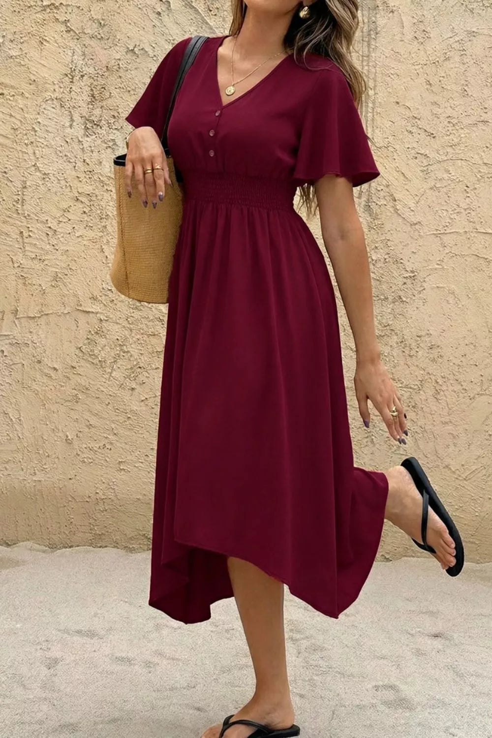 Burgundy V-neck flutter sleeve midi dress with button detail and smocked waist