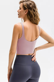 Lilac performance scoop crop top with thin straps and a cropped fit.