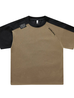 Taupe and black color block t-shirt with round neck and graphic detail.
