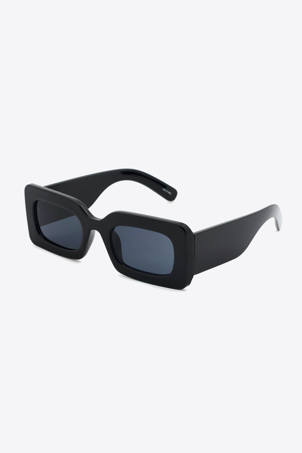 Black acetate rectangle sunglasses with dark lenses and thick frames.