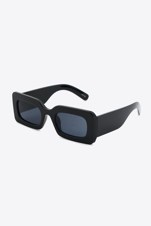 Black acetate rectangle sunglasses with dark lenses and thick frames.