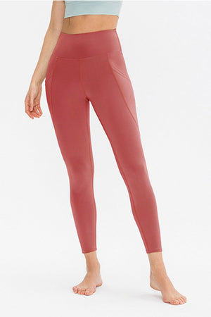 Sculpted Pocket Performance Leggings in watermelon pink with side pockets and a high waist.