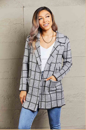 Gray grid-print knit blazer coat with pockets and lapels, styled open over a white top.