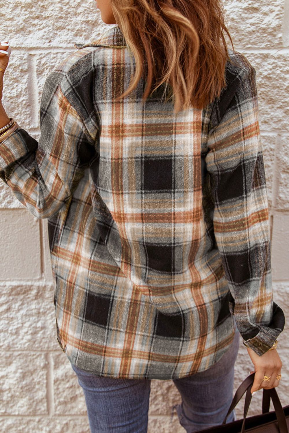 Oversized plaid shacket in black with button front and long sleeves.