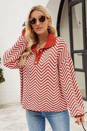 Chevron knit polo sweater in rust and white with button detail.