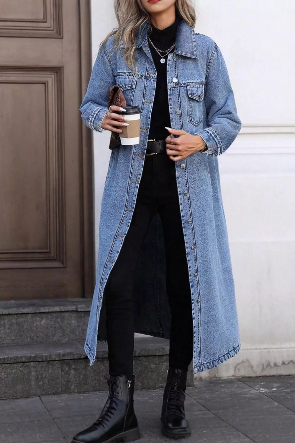 Longline blue denim jacket with pockets, full button front, and collared neckline.