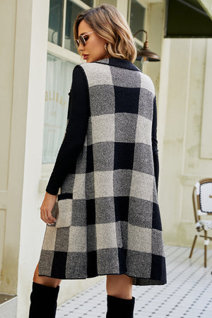 Longline checked plaid vest in black and tan acrylic, with a collared neckline and open front.